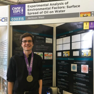 Jackson Weir standing in front of CWSF project