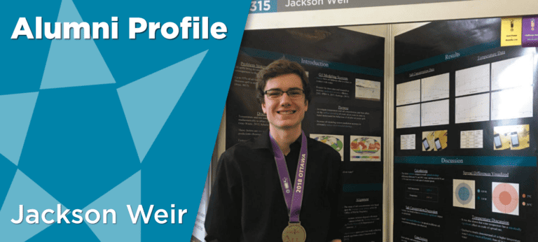 Jackson Weir in front of science fair project