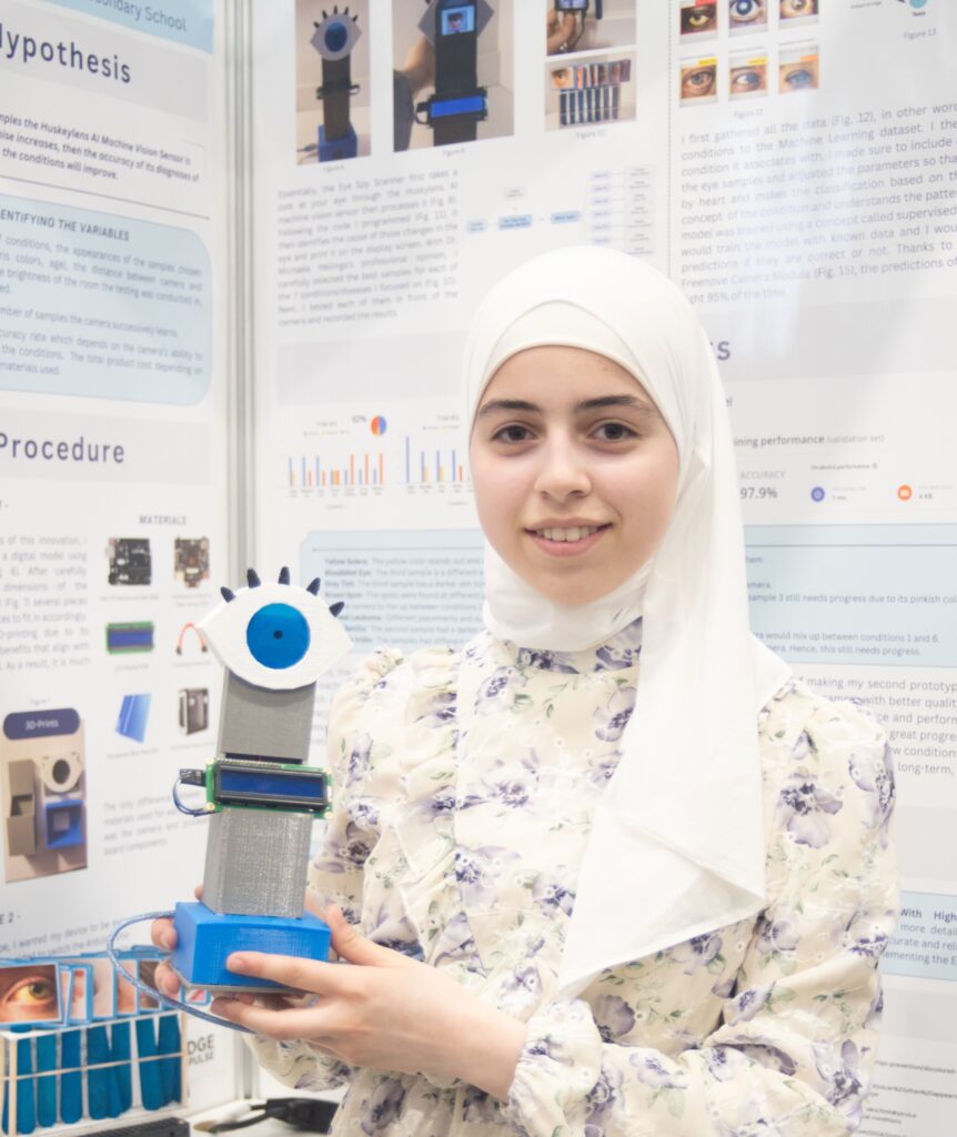 Innovative young girl presenting her STEM project with a robot at Youth Science Canada science fair.